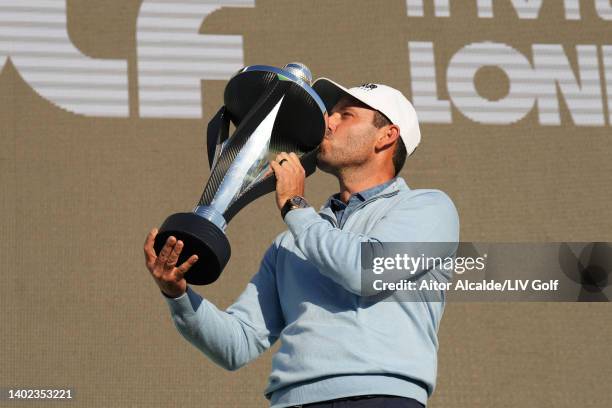 Charl Schwartzel of Stinger GC celebrates with the LIV Golf Invitational individual trophy following victory during day three of LIV Golf...