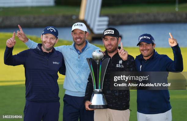 Charl Schwartzel, Branden Grace, Louis Oosthuizen and Hennie du Plessis of Stinger GC celebrate with the LIV Golf Invitational Team trophy following...