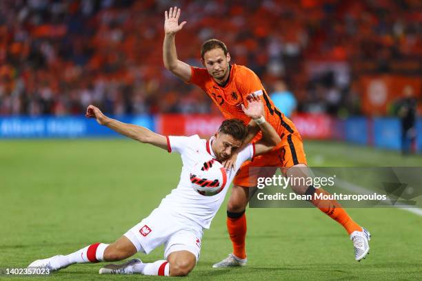 Daley Blind of Netherlands is challenged by Matty Cash of Poland during the UEFA Nations League - League A Group 4 match between Netherlands and...