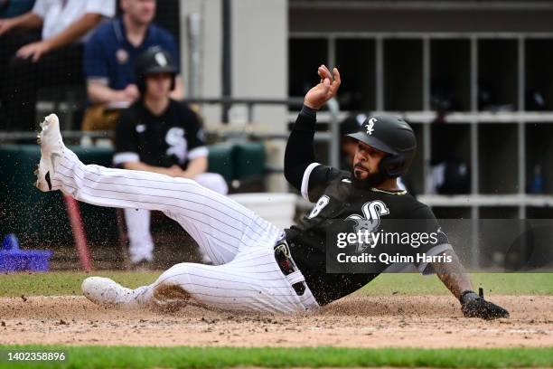 Leury Garcia of the Chicago White Sox slides home to score in the fifth inning against the Texas Rangers at Guaranteed Rate Field on June 11, 2022 in...