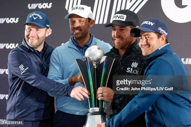 Branden Grace, Charl Schwartzel, Louis Oosthuizen and Hennie du Plessis of Stinger GC smile with the trophy during a press conference after Stinger...
