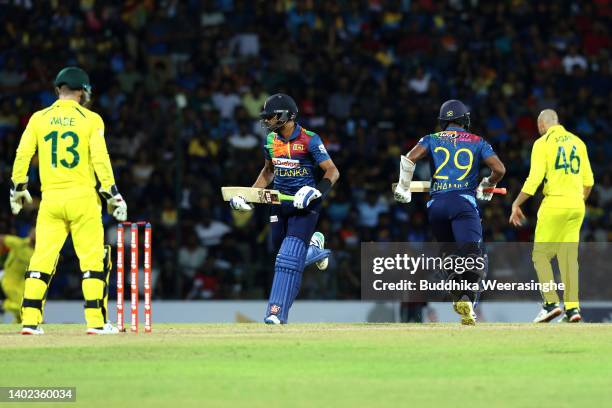 Sri Lanka captain Dasun Shanaka, left, and Chamika Karunaratne take a quick run during the 3rd match in the T20 International series between Sri...