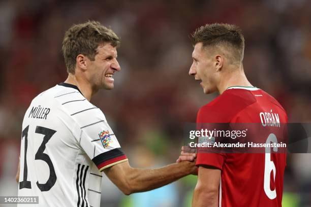 Thomas Mueller of Germany speaks to Willi Orban of Hungary during the UEFA Nations League League A Group 3 match between Hungary and Germany at...