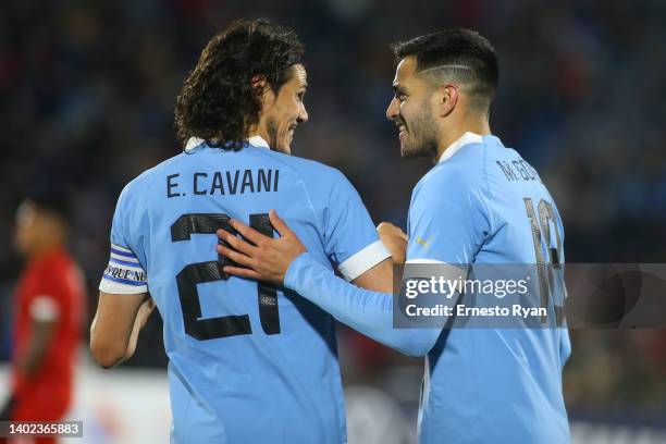 Maximiliano Gómez of Uruguay celebrates with teammate Edinson Cavani after scoring the fourth goal of his team during a match between Uruguay and...