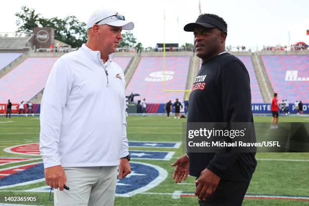 Head coach Skip Holtz of the Birmingham Stallions and head coach Kevin Sumlin of the Houston Gamblers talk on the field before the game at Protective...