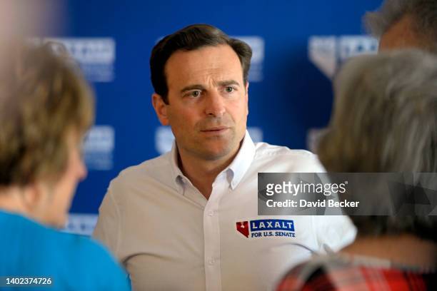 Nevada GOP Senate candidate Adam Laxalt speaks with people during a campaign event at Pirates Landing restaurant on June 11, 2022 in Logandale,...
