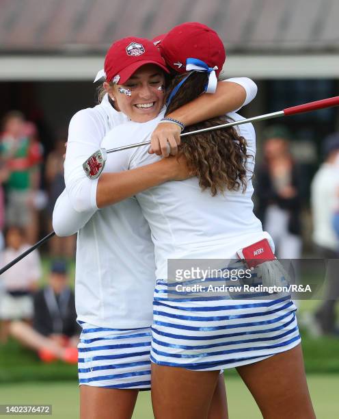 Rachel Kuehn of Team USA and Amari Avery of Team USA embrace on the 18th green after winning their match during the Afternoon Foursomes on Day wo of...