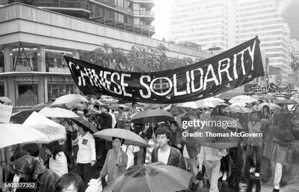 Protesters carry a banner at a demonstration against the Chinese government's brutality during the protests in Tiananmen Square in 1989 in New York...