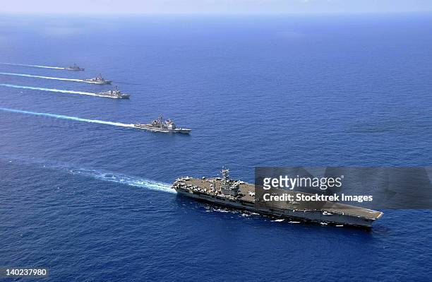 military ships operate in formation in the south china sea. - south china sea ship stock pictures, royalty-free photos & images