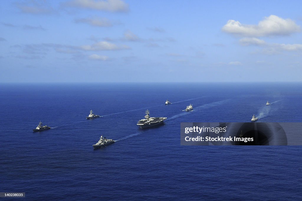 Ships from the Ronald Reagan Carrier Strike Group transit the Pacific Ocean.