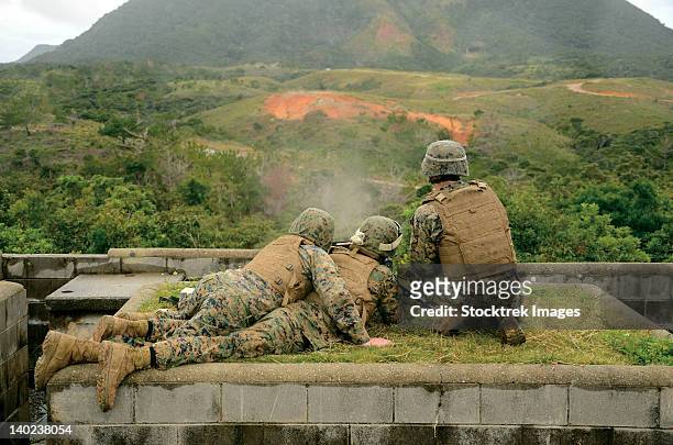 marines engage unknown-distance targets at camp schwab, japan. - boot camp stock pictures, royalty-free photos & images