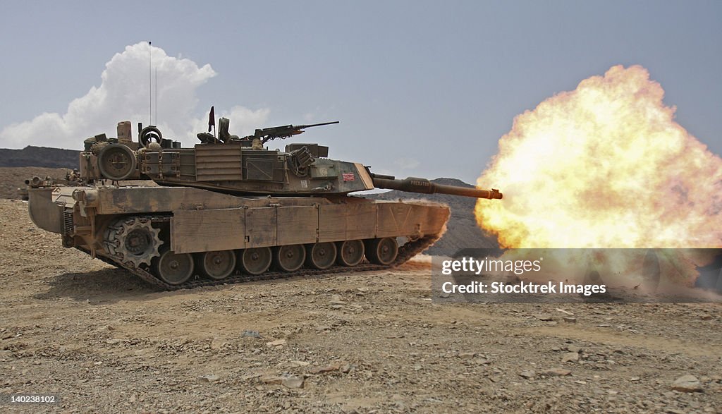 Marines bombard through a live fire range using M1A1 Abrams tanks.