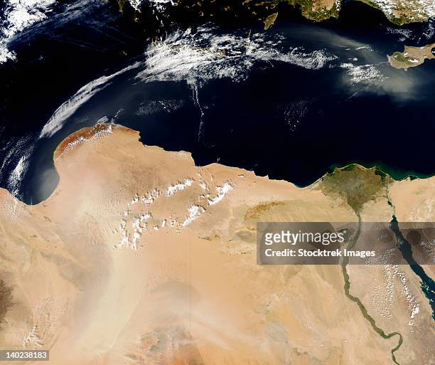 october 1, 2010 - satellite view of a dust storm over libya. - nile delta stock pictures, royalty-free photos & images