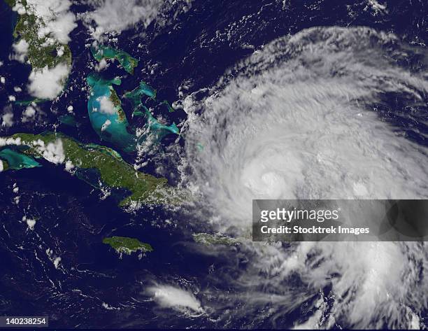 august 23, 2011 - satellite view of hurricane irene approaching the bahamas. no eye is visible in this image, but the extent of irene's large cloud cover is seen from eastern cuba over hispaniola. - puerto rico hurricane stock pictures, royalty-free photos & images