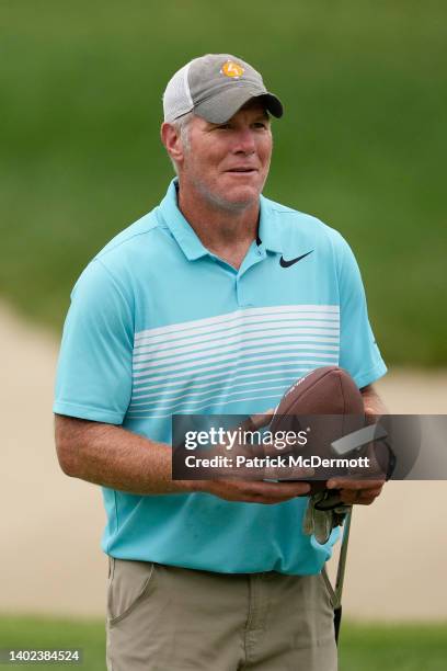 Former NFL player Brett Favre walks up the 14th fairway during the Celebrity Foursome at the second round of the American Family Insurance...