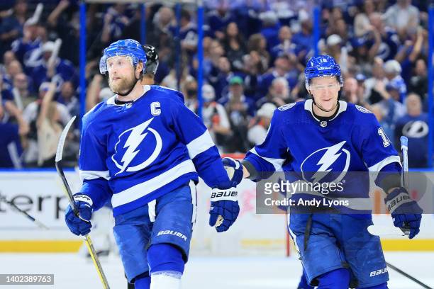 Steven Stamkos of the Tampa Bay Lightning celebrates with teammate Ondrej Palat after scoring a goal on Igor Shesterkin of the New York Rangers...