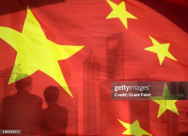 businessmen looking at buildings. - chinese flag stock pictures, royalty-free photos & images
