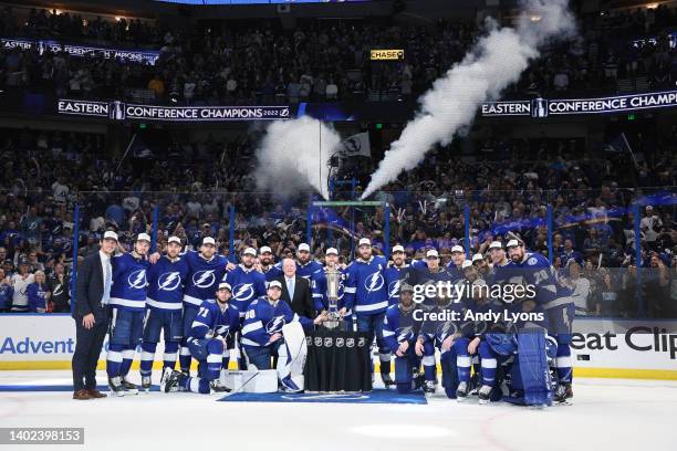 The Tampa Bay Lightning pose with the Eastern Conference Prince of Wales Trophy after defeating the New York Rangers with a score of 2 to 1 in Game...