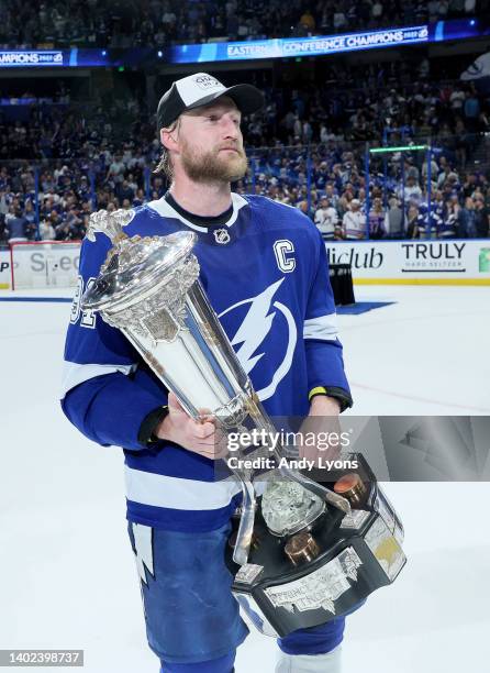 Steven Stamkos of the Tampa Bay Lightning skates with the Eastern Conference Prince of Wales Trophy after defeating the New York Rangers with a score...