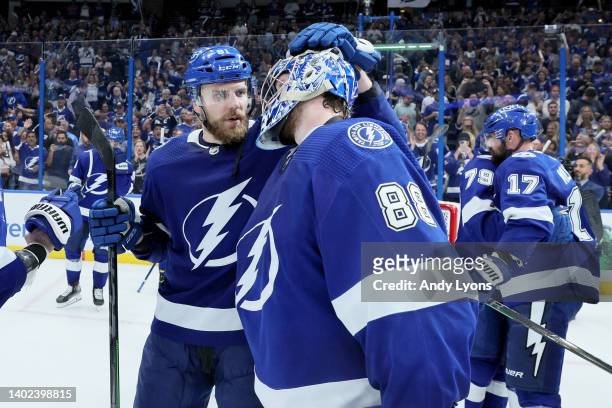 Erik Cernak and Andrei Vasilevskiy of the Tampa Bay Lightning celebrate after defeating the New York Rangers with a score of 2 to 1 in Game Six to...