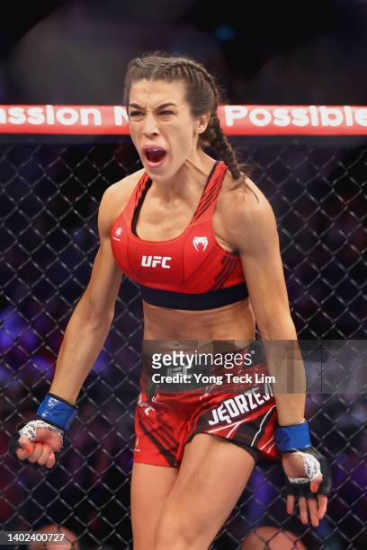 Joanna Jedrzejcyk of Poland reacts prior to facing Zhang Weili of China during their Women's Strawweight Fight at Singapore Indoor Stadium on June...