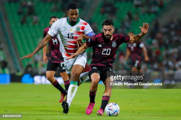 Ryan Donk of Suriname struggles for the ball with Rodolfo Pizarro of Mexico during the match between Mexico and Suriname as part of the CONCACAF...