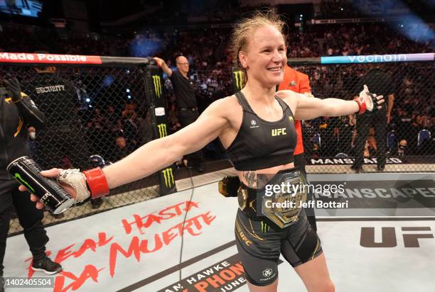 Valentina Shevchenko of Kyrgyzstan reacts after her split-decision victory over Taila Santos of Brazil in the UFC flyweight championship fight during...