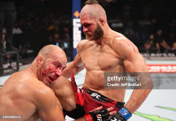 Jiri Prochazka of Czech Republic knees Glover Teixeira of Brazil in the UFC light heavyweight championship fight during the UFC 275 event at...