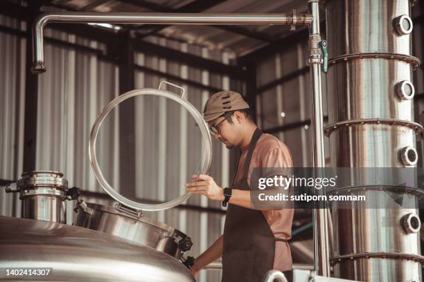 brewers take their beer seriously. - stills stock pictures, royalty-free photos & images