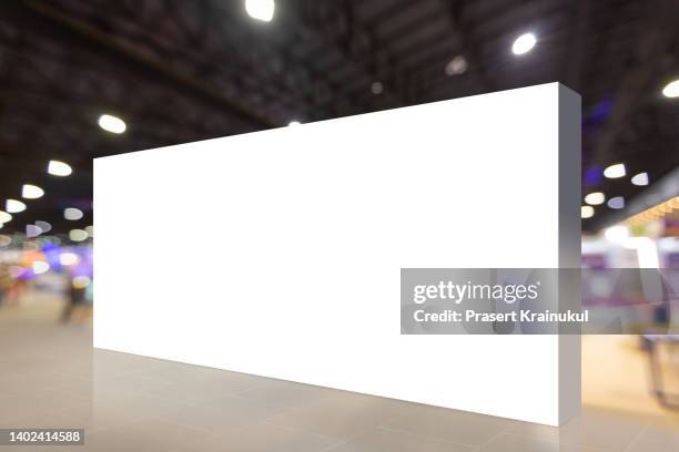 mock up large blank white billboard on walkway - man standing white background stock-fotos und bilder