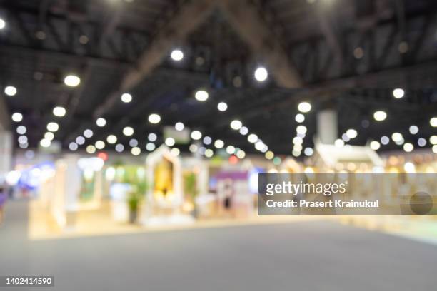 mock up of large blank white billboard on walkway with blur background. - tradeshow stock pictures, royalty-free photos & images