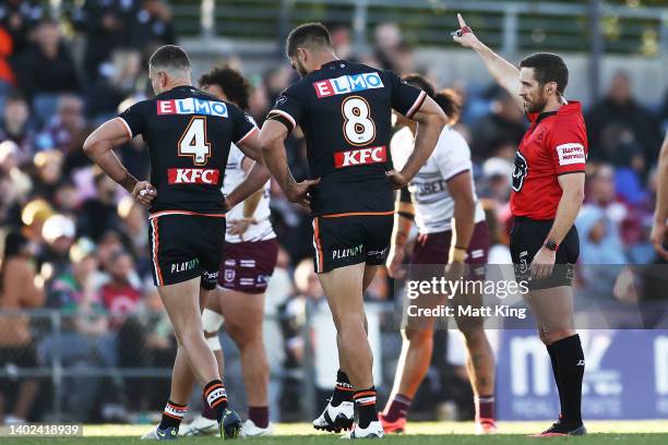 Brent Naden of the Tigers is sent off by referee Peter Gough for a tackle on Jake Trbojevic of the Sea Eagles during the round 14 NRL match between...