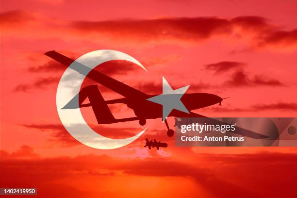 military unmanned aerial vehicle on the background of the turkish flag. combat drone in military conflicts - combat command and control system stock pictures, royalty-free photos & images