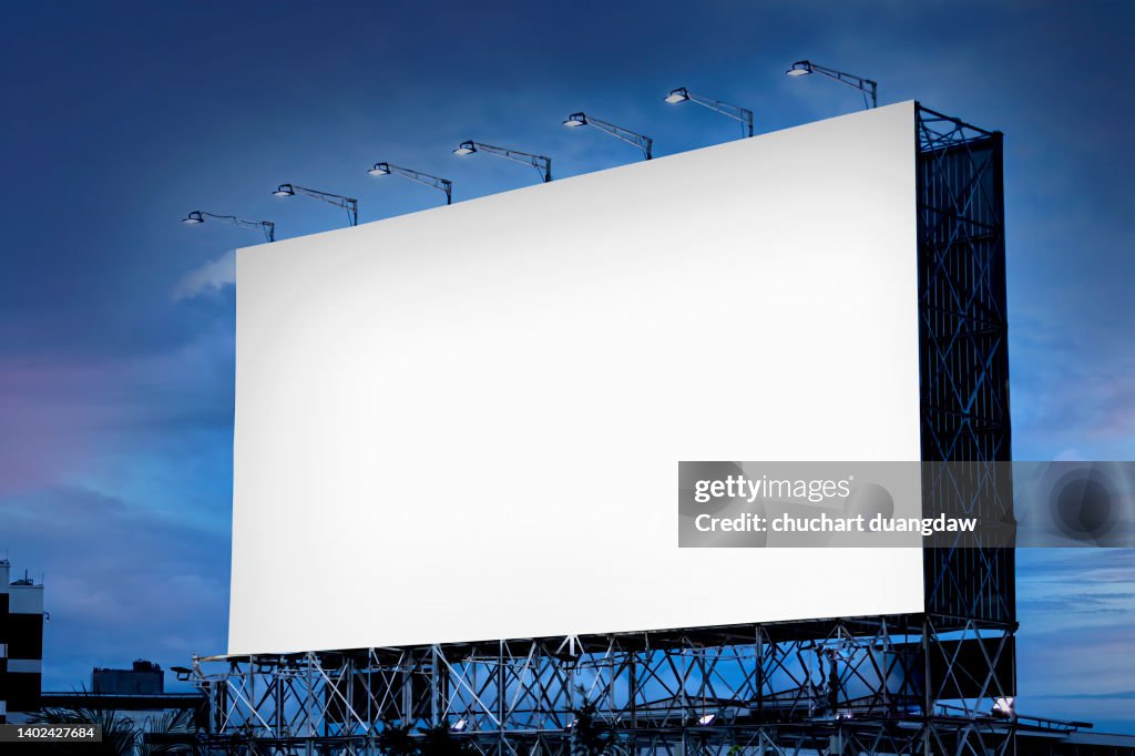 Blank billboard with on road with city view background and blue sky background