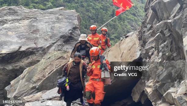 Rescuers evacuate villagers at Caodeng township on June 11, 2022 in Barkam, Aba Tibetan and Qiang Autonomous Prefecture, Sichuan Province of China. A...