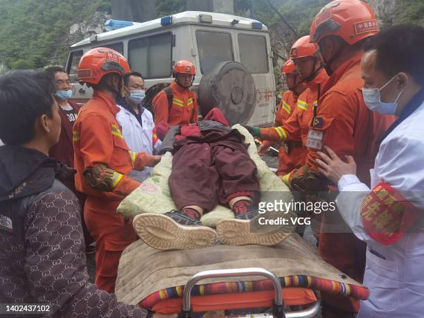 Rescuers evacuate a villager at Caodeng township on June 11, 2022 in Barkam, Aba Tibetan and Qiang Autonomous Prefecture, Sichuan Province of China....