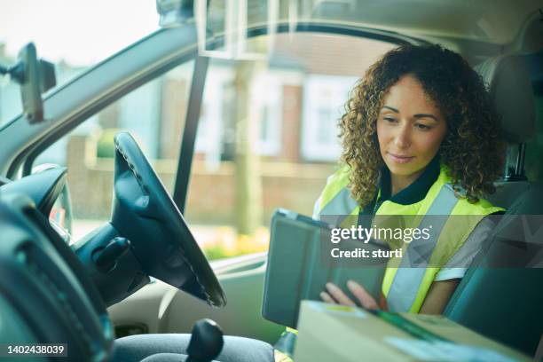 delivery driver with pda - global positioning system stock pictures, royalty-free photos & images