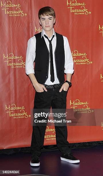 Justin Bieber's 'biggest fan' unveils the new Bieber wax figure at Madame Tussauds Hollywood on the singer's 18th Birthday on March 1, 2012 in...