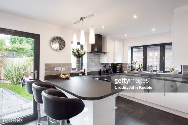 property kitchen interiors - grey slate stock-fotos und bilder