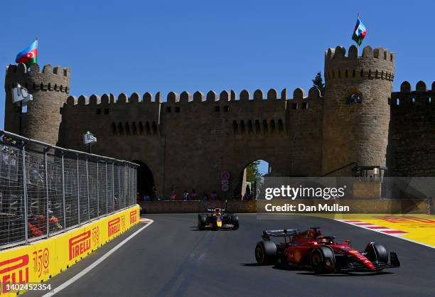 Charles Leclerc of Monaco driving the Ferrari F1-75 leads Max Verstappen of the Netherlands driving the Oracle Red Bull Racing RB18 during the F1...