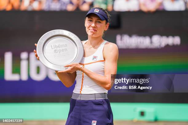 Ekaterina Alexandrova of Russia poses with her trophy after the Womens Singles Final match between Aryna Sabalenka of Belarus and Ekaterina...