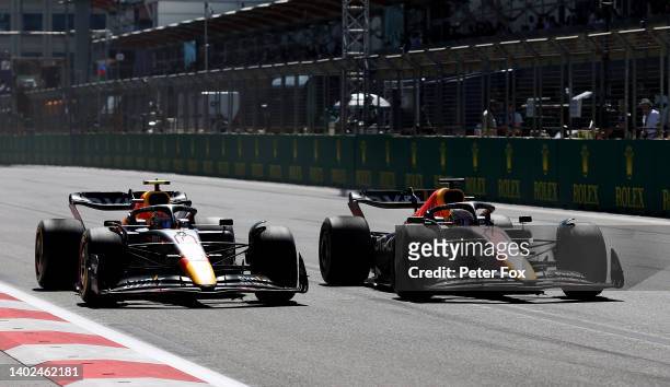 Max Verstappen of the Netherlands driving the Oracle Red Bull Racing RB18 overtakes Sergio Perez of Mexico driving the Oracle Red Bull Racing RB18...