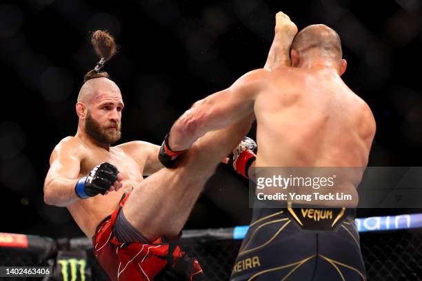 Jiri Prochazka of the Czech Republic kicks Glover Teixeira of Brazil in their light heavyweight title bout during UFC 275 at Singapore Indoor Stadium...
