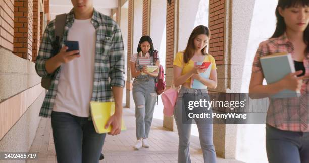 students walking and talking - clumsy walker stock pictures, royalty-free photos & images