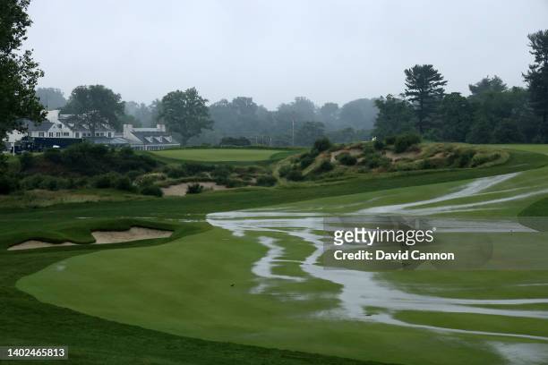 The par four 16th hole flooded as heavy morning rain delays play during the singles matches on day three of The 2022 Curtis Cup at Merion Golf Club...