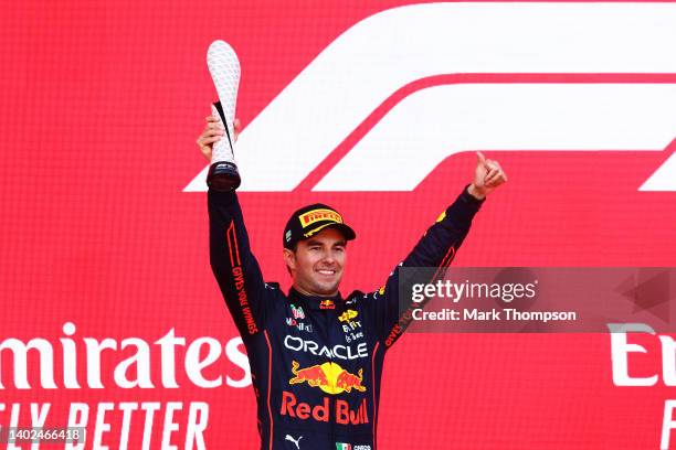 Second placed Sergio Perez of Mexico and Oracle Red Bull Racing celebrates on the podium during the F1 Grand Prix of Azerbaijan at Baku City Circuit...