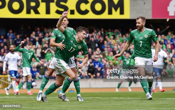 Paddy McNair of Northern Ireland celebrates with Dion Charles and Niall McGinn after scoring their team's first goal during the UEFA Nations League...