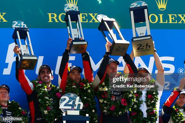 The Toyota Gazoo Racing GR010 Hybrid team of Sebastien Buemi, Brendon Hartley, Ryo Hirakawa, and former Toyota driver Kazuki Nakajimi celebrate on...