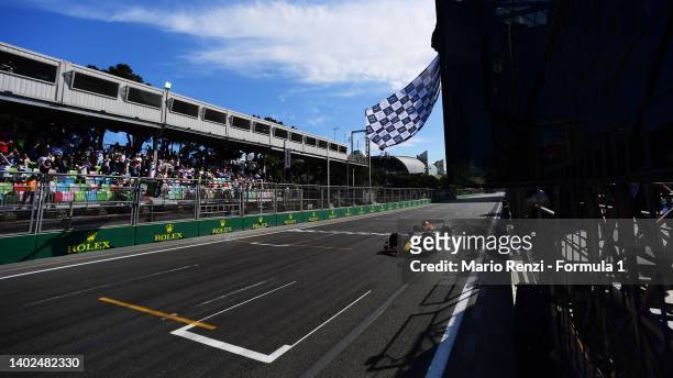 Race winner Max Verstappen of the Netherlands driving the Oracle Red Bull Racing RB18 takes the chequered flag during the F1 Grand Prix of Azerbaijan...