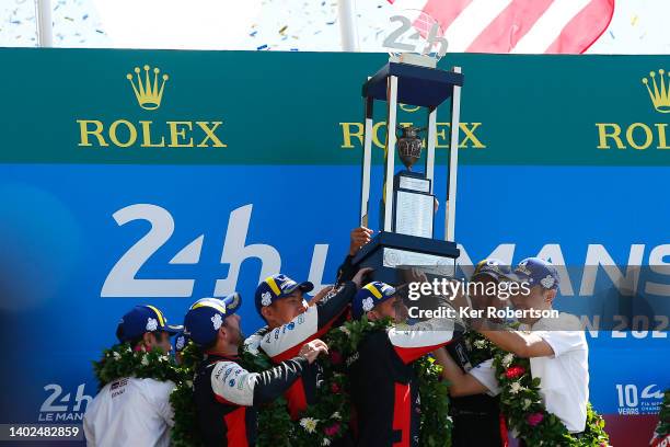 The Toyota Gazoo Racing GR010 Hybrid team of Sebastien Buemi, Brendon Hartley, Ryo Hirakawa, get help lifting the trophy with second placed team...